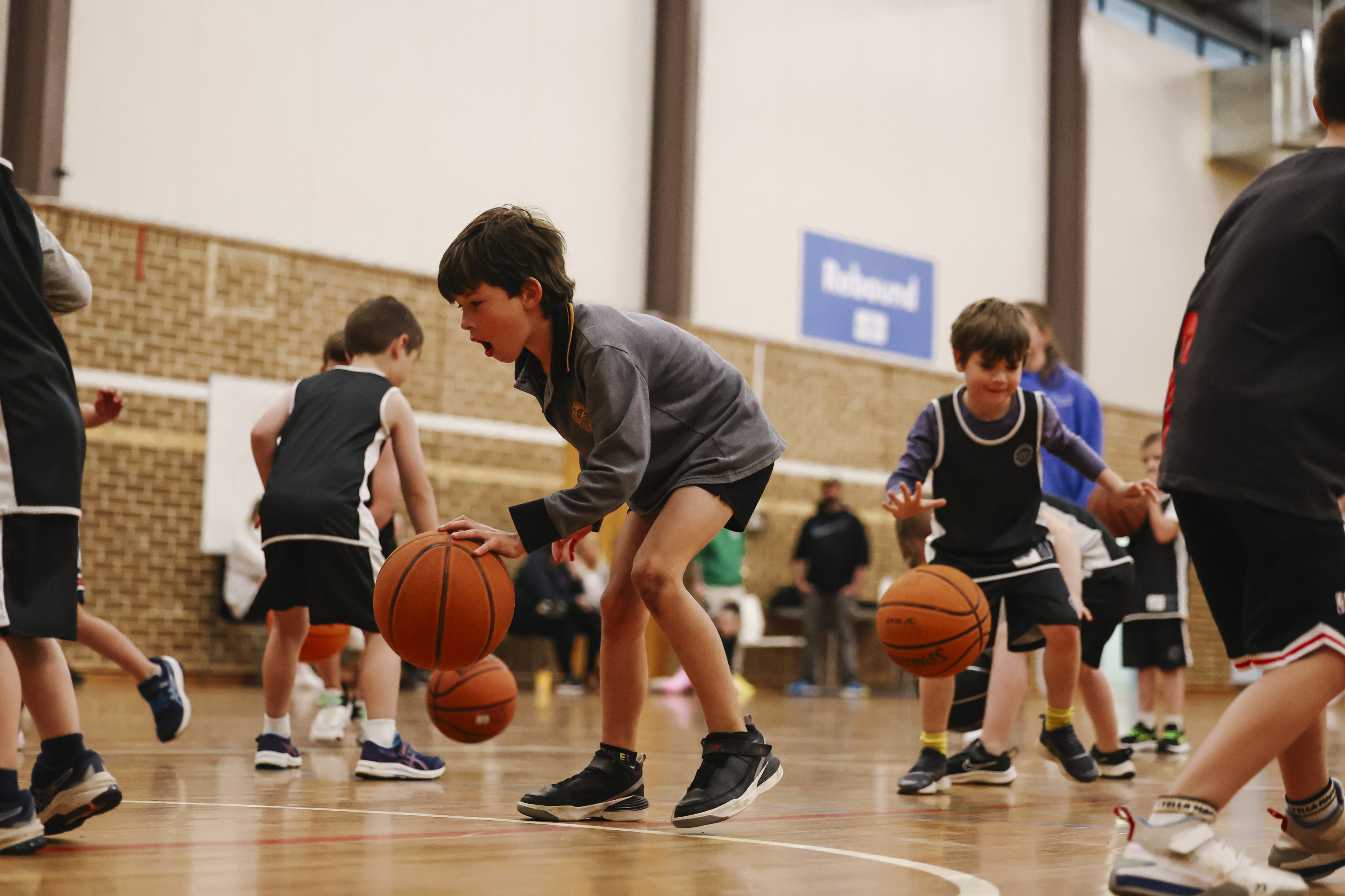 Young kids dribbling